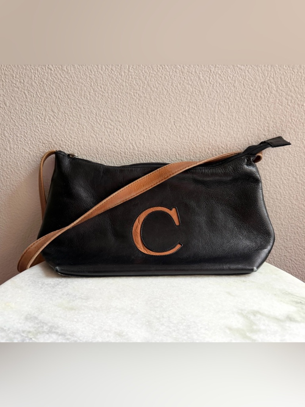 Black Leather Shoulder Bag with Tan Accent and 'C' Detail
